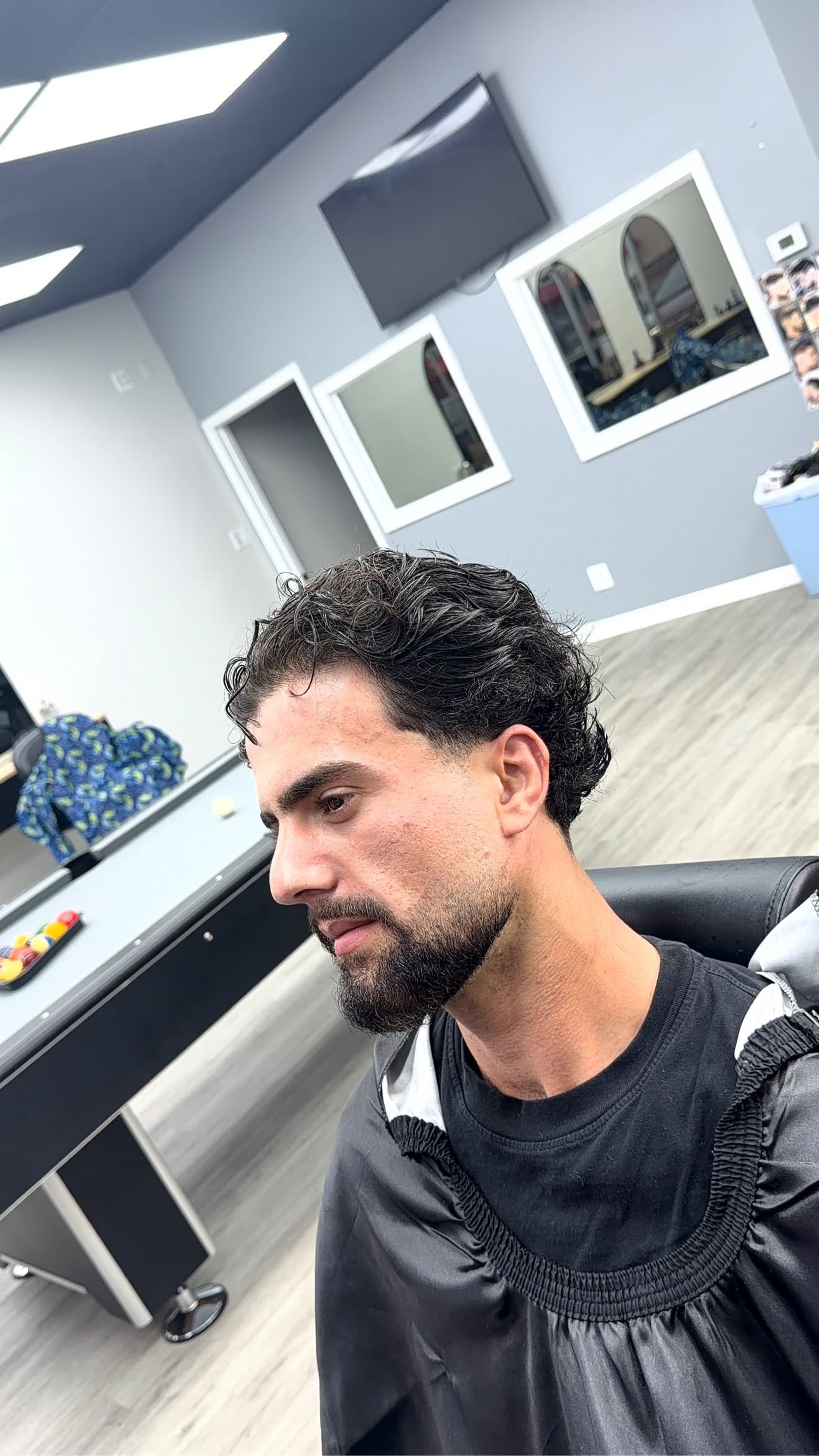 Textured haircut and beard finished by Ray