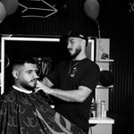 Ray working with a client in the barber chair